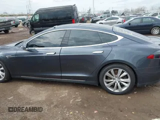 2015 Tesla Model S 85D with VIN 5YJSA1E21FF116775, listed as a IAAI auction lot 41876772 with 128,805 mi miles. Bid and sale history available at carsss.com. Image 15.