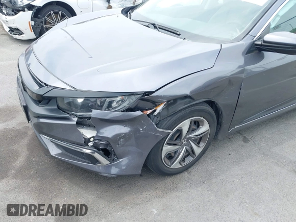 2020 Honda Civic LX z VIN 2HGFC2F60LH596396, wystawiony jako IAAI lot #42354812 z przebiegiem 62 082 mil mil oraz . Historia ofert i sprzedaży dostępna na DreamBid. Obrazek 6.