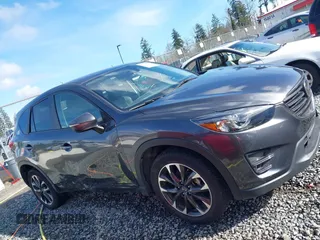 2016 Mazda CX-5 Grand Touring with VIN JM3KE4DY9G0895006, listed as a IAAI auction lot 41703146 with 39,359 mi miles. Bid and sale history available at carsss.com. Image 13.