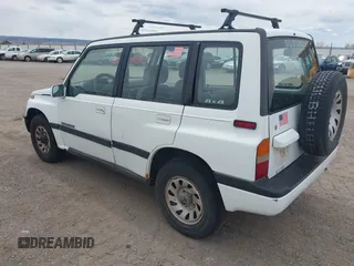 1995 Suzuki Sidekick JX z VIN 2S3TD03V8S6413255, wystawiony jako IAAI lot #42160109 z przebiegiem 225 454 mil mil oraz . Historia ofert i sprzedaży dostępna na DreamBid. Obrazek 3.