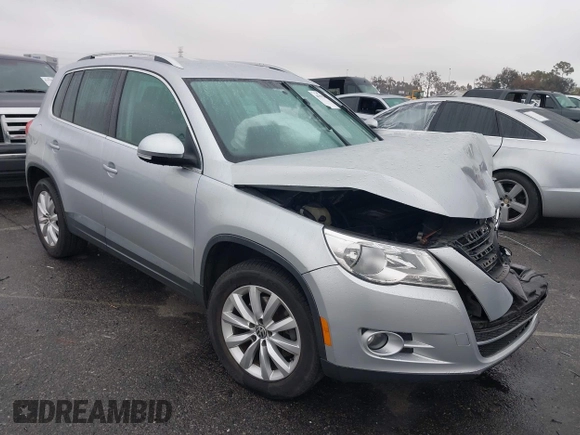 2011 Volkswagen Tiguan SEL w/Premium Navi with VIN WVGAV7AX7BW547613, listed as a IAAI auction lot 41916574 with 140,385 mi miles and . Bid and sale history available at DreamBid. Image 1.
