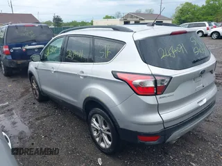 2018 Ford Escape SE with VIN 1FMCU9G99JUC41605, listed as a IAAI auction lot 39500946 with 114,032 mi miles. Bid and sale history available at carsss.com. Image 3.