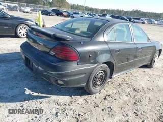 2004 Pontiac Grand Am SE with VIN 1G2NE52F74C226518, listed as a IAAI auction lot 41235829 with 215,862 mi miles. Bid and sale history available at carsss.com. Image 4.