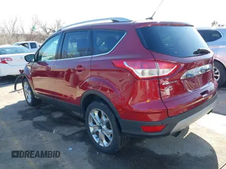 2014 Ford Escape Titanium with VIN 1FMCU9J97EUB79748, listed as a IAAI auction lot 41884915 with 197,899 mi miles. Bid and sale history available at carsss.com. Image 3.