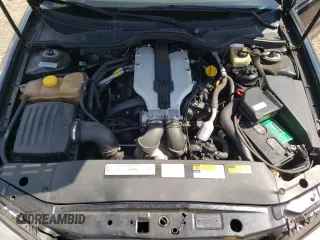 2000 Cadillac Catera z VIN W06VR54R0YR011736, wystawiony jako Copart lot #54927395 z przebiegiem 45 892 mil mil oraz Szkoda całkowita • Salvage title. Historia ofert i sprzedaży dostępna na DreamBid. Obrazek 11.