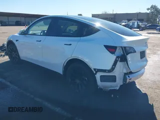 2023 Tesla Model Y Long Range with VIN 7SAYGDEE0PF945202, listed as a IAAI auction lot 41611762 with 7,316 mi miles and . Bid and sale history available at DreamBid. Image 3.