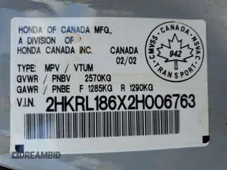 2002 Honda Odyssey EX z VIN 2HKRL186X2H006763, wystawiony jako Copart lot #57317075 z przebiegiem 282 090 mil mil oraz Szkoda całkowita • Salvage title. Historia ofert i sprzedaży dostępna na DreamBid. Obrazek 13.