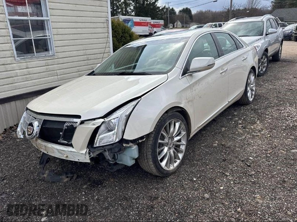 2013 Cadillac XTS Platinum z VIN 2G61V5S33D9173441, wystawiony jako IAAI lot #41902672 z przebiegiem 103 044 mil mil oraz . Historia ofert i sprzedaży dostępna na DreamBid. Obrazek 2.
