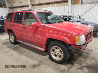 1996 Jeep Grand Cherokee Limited with VIN 1J4GZ78Y3TC186413, listed as a Copart auction lot 82370854 with 261,630 mi miles and Salvage Title. Bid and sale history available at carsss.com. Image 4.