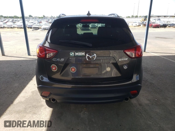 2016 Mazda CX-5 Touring z VIN JM3KE2CY4G0805072, wystawiony jako Copart lot #58435535 z przebiegiem 146 323 mil mil oraz Szkoda całkowita • Salvage title. Historia ofert i sprzedaży dostępna na DreamBid. Obrazek 6.