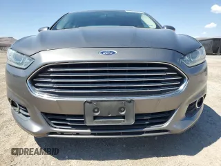 2014 Ford Fusion SE Hybrid with VIN 3FA6P0LU3ER306739, listed as a Copart auction lot 69887454 with 114,150 mi miles and Salvage title. Bid and sale history available at DreamBid. Image 5.