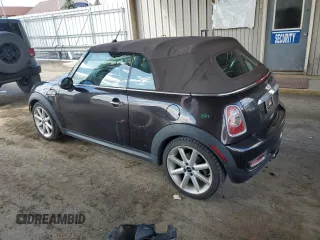 2014 MINI Convertible S with VIN WMWZP3C55ET706573, listed as a Copart auction lot 52325705 with 125,076 mi miles and Salvage Title. Bid and sale history available at DreamBid. Image 2.