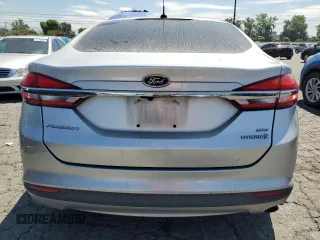 2017 Ford Fusion Hybrid SE z VIN 3FA6P0LU9HR306927, wystawiony jako Copart lot #63943395 z przebiegiem 157 851 mil mil oraz Czysty tytuł • Clean title. Historia ofert i sprzedaży dostępna na DreamBid. Obrazek 6.