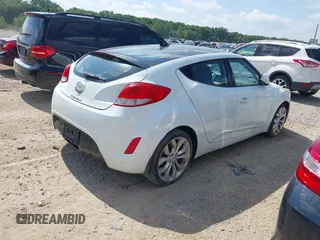 2013 Hyundai Veloster w/Black Int with VIN KMHTC6AD2DU131983, listed as a IAAI auction lot 42671646 with 131,731 mi miles and . Bid and sale history available at DreamBid. Image 4.