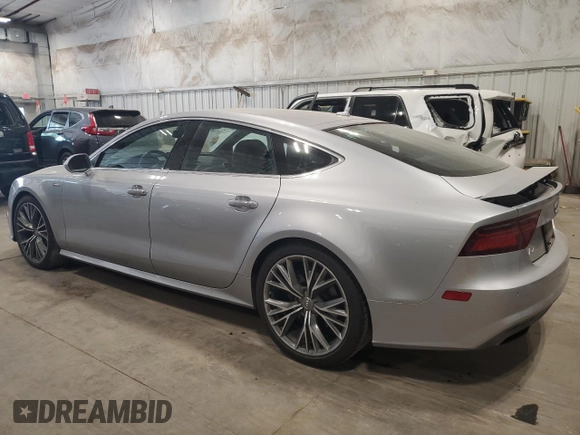 2016 Audi A7 3.0 Prestige with VIN WAU2GAFC7GN104801, listed as a Copart auction lot 64997833 with 74,427 mi miles. Bid and sale history available at carsss.com. Image 2.