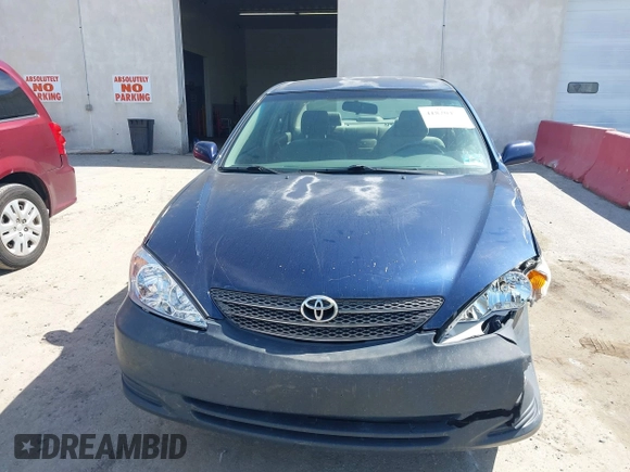 2002 Toyota Camry LE z VIN JTDBE32KX20111362, wystawiony jako IAAI lot #41820475 z przebiegiem 270 091 mil mil oraz . Historia ofert i sprzedaży dostępna na DreamBid. Obrazek 12.