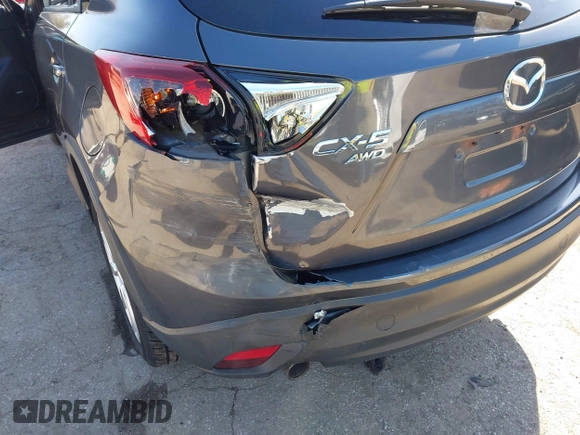 2014 Mazda CX-5 Grand Touring with VIN JM3KE4DY4E0320695, listed as a IAAI auction lot 41989350 with 169,391 mi miles and . Bid and sale history available at DreamBid. Image 6.
