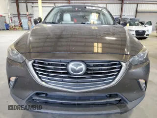 2017 Mazda CX-3 Grand Touring z VIN JM1DKFD74H0163736, wystawiony jako Copart lot #57871265 z przebiegiem 212 515 mil mil oraz Szkody całkowita. Historia ofert i sprzedaży dostępna na DreamBid. Obrazek 5.