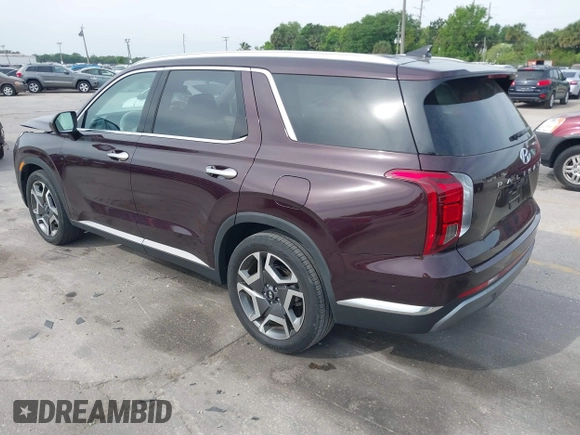 2023 Hyundai Palisade Limited z VIN KM8R54GE0PU517573, wystawiony jako IAAI lot #41870400 z przebiegiem 11 477 mil mil oraz . Historia ofert i sprzedaży dostępna na DreamBid. Obrazek 3.