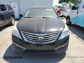 2015 Hyundai Azera z VIN KMHFG4JGXFA483603, wystawiony jako Copart lot #56866945 z przebiegiem 164 009 mil mil oraz Czysty tytuł • Clean title. Historia ofert i sprzedaży dostępna na DreamBid. Obrazek 5.