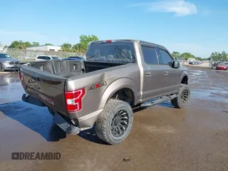 2018 Ford F-150 XL with VIN 1FTEW1EG1JFC31794, listed as a IAAI auction lot 41304111 with 129,058 mi miles and . Bid and sale history available at carsss.com. Image 4.
