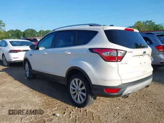 2017 Ford Escape Titanium with VIN 1FMCU0J90HUC51244, listed as a IAAI auction lot 42206165 with 106,847 mi miles and . Bid and sale history available at DreamBid. Image 3.