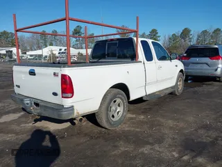 2000 Ford F-150 XL with VIN 1FTZX172XYNB36456, listed as a IAAI auction lot 41554603 with 239,766 mi miles. Bid and sale history available at carsss.com. Image 4.
