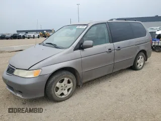 2000 Honda Odyssey EX z VIN 2HKRL186XYH010384, wystawiony jako Copart lot #60871845 z przebiegiem 423 167 mil mil oraz Czysty tytuł • Clean title. Historia ofert i sprzedaży dostępna na DreamBid. Obrazek 1.