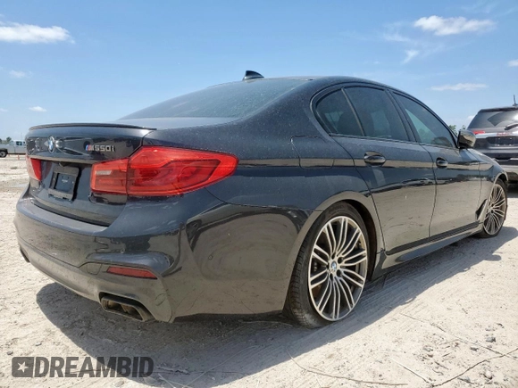 2019 BMW 5 Series M550i xDrive with VIN WBAJB9C51KB287797, listed as a Copart auction lot 65382465 with 61,459 mi miles and Salvage title. Bid and sale history available at DreamBid. Image 3.