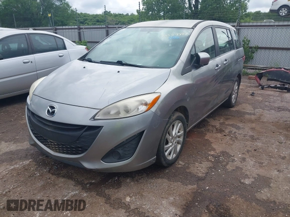 2012 Mazda 5 Sport with VIN JM1CW2BL0C0111151, listed as a IAAI auction lot 42359887 with 158,986 mi miles and . Bid and sale history available at DreamBid. Image 2.