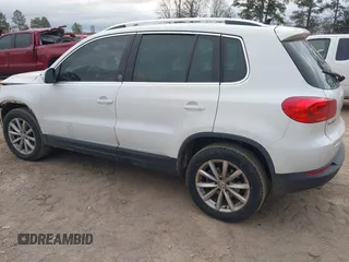 2017 Volkswagen Tiguan Wolfsburg Edition with VIN WVGRV7AX5HK019734, listed as a IAAI auction lot 41391911 with 123,005 mi miles and . Bid and sale history available at DreamBid. Image 3.