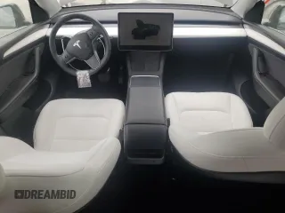 2023 Tesla Model Y Long Range with VIN 7SAYGAEE0PF642810, listed as a Copart auction lot 52181655 with 74,922 mi miles and Salvage Title. Bid and sale history available at DreamBid. Image 8.