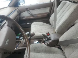 1989 Toyota Camry z VIN JT2SV21W5K0240987, wystawiony jako Copart lot #42248385 z przebiegiem 246 651 mil mil oraz Czysty tytuł • Clean title. Historia ofert i sprzedaży dostępna na DreamBid. Obrazek 8.