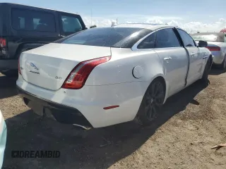 2014 Jaguar XJ Portfolio z VIN SAJWA2GZ0E8V59422, wystawiony jako Copart lot #74213414 z przebiegiem 96 314 mil mil oraz Nie do naprawy • Non repairable. Historia ofert i sprzedaży dostępna na DreamBid. Obrazek 3.