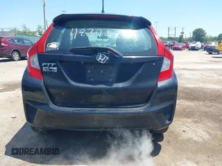 2015 Honda Fit LX z VIN 3HGGK5H56FM712266, wystawiony jako IAAI lot #42378228 z przebiegiem 140 423 mil mil oraz . Historia ofert i sprzedaży dostępna na DreamBid. Obrazek 16.