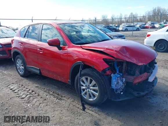 2016 Mazda CX-5 Touring with VIN JM3KE4CY5G0630438, listed as a IAAI auction lot 41877660 with 56,960 mi miles. Bid and sale history available at carsss.com. Image 1.