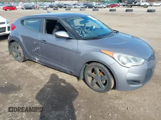 2013 Hyundai Veloster w/Black Int with VIN KMHTC6AD5DU172964, listed as a IAAI auction lot 41768827 with 102,782 mi miles and . Bid and sale history available at DreamBid. Image 1.