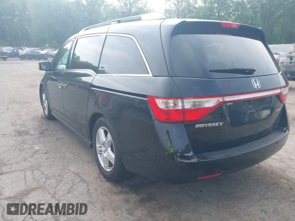 2011 Honda Odyssey Touring with VIN 5FNRL5H93BB104906, listed as a IAAI auction lot 42371279 with 183,856 mi miles and . Bid and sale history available at DreamBid. Image 3.