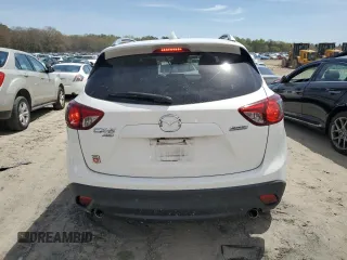 2015 Mazda CX-5 Grand Touring with VIN JM3KE4DY0F0458719, listed as a Copart auction lot 52960365 with 128,372 mi miles and Salvage Title. Bid and sale history available at DreamBid. Image 6.