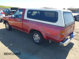 1992 Toyota Pickup DLX z VIN 4TARN81PXNZ030799, wystawiony jako IAAI lot #41879500 z przebiegiem 221 198 mil mil oraz . Historia ofert i sprzedaży dostępna na DreamBid. Obrazek 3.