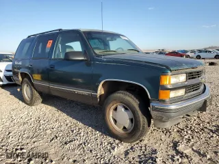 1999 Chevrolet Tahoe Z71 with VIN 1GNEK13R0XJ512661, listed as a Copart auction lot 68022173 with 181,573 mi miles and Salvage Title. Bid and sale history available at carsss.com. Image 4.