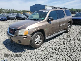 2003 GMC Envoy SLT with VIN 1GKET16S136235010, listed as a Copart auction lot 57380734 with 161,818 mi miles and Salvage Title. Bid and sale history available at DreamBid. Image 1.