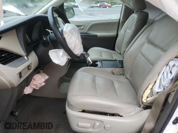 2015 Toyota Sienna LE with VIN 5TDJK3DCXFS126604, listed as a Copart auction lot 56987355 with 102,079 mi miles and Salvage title. Bid and sale history available at DreamBid. Image 7.