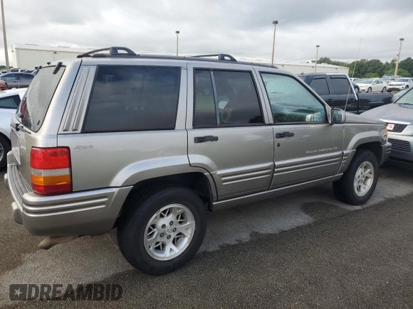 1998 Jeep Grand Cherokee Limited with VIN 1J4GZ78S2WC222768, listed as a Copart auction lot 73942154 with Not provided miles and Salvage title. Bid and sale history available at DreamBid. Image 3.