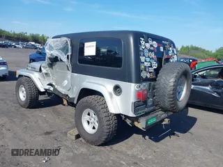 2005 Jeep Wrangler Unlimited with VIN 1J4FA44S55P352803, listed as a IAAI auction lot 42688284 with 128,586 mi miles and . Bid and sale history available at DreamBid. Image 3.