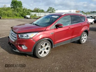 2019 Ford Escape Titanium with VIN 1FMCU0J98KUC00873, listed as a Copart auction lot 61674305 with 53,554 mi miles and Salvage title. Bid and sale history available at DreamBid. Image 1.