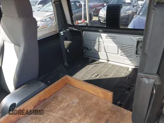 2004 Jeep Wrangler Sport Right Hand Drive with VIN 1J4F449SX4P780560, listed as a IAAI auction lot 41645721 with 146,681 mi miles. Bid and sale history available at carsss.com. Image 8.