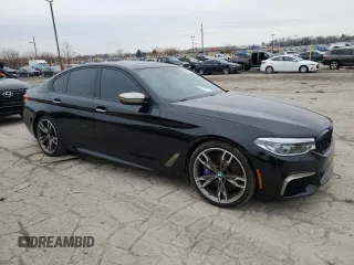 2018 BMW 5 Series M550i xDrive with VIN WBAJB9C56JB049524, listed as a Copart auction lot 43511805 with 55,759 mi miles and Salvage title. Bid and sale history available at DreamBid. Image 4.