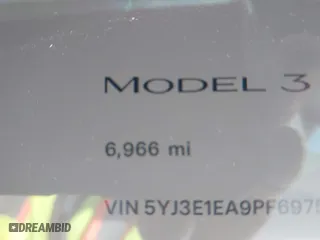 2023 Tesla Model 3 with VIN 5YJ3E1EA9PF697573, listed as a IAAI auction lot 41173833 with 6,966 mi miles. Bid and sale history available at carsss.com. Image 15.