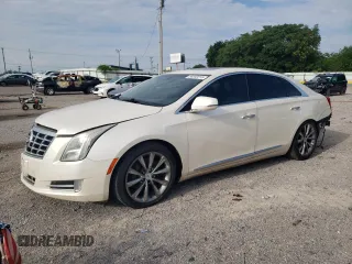 2013 Cadillac XTS Luxury with VIN 2G61P5S37D9186395, listed as a Copart auction lot 56859015 with 132,458 mi miles and Salvage title. Bid and sale history available at DreamBid. Image 1.